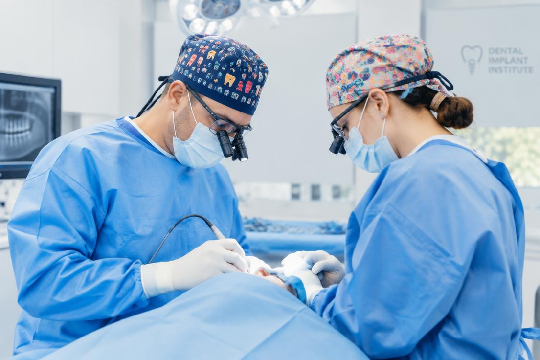 Surgeons performing implant surgery in the operatory